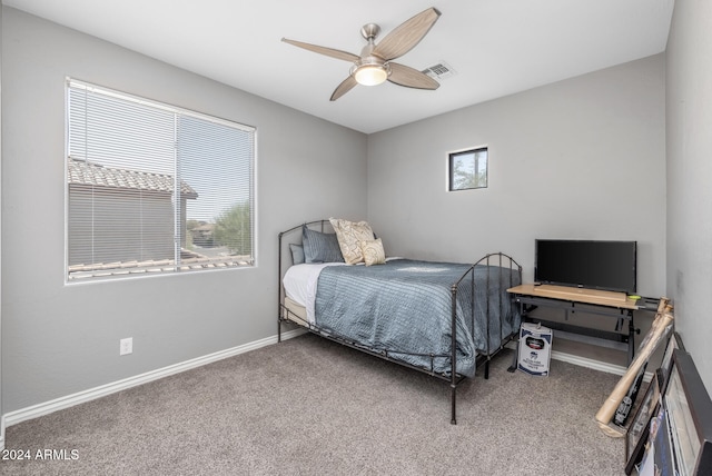 carpeted bedroom with ceiling fan