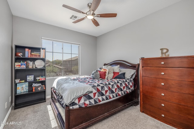 carpeted bedroom with ceiling fan