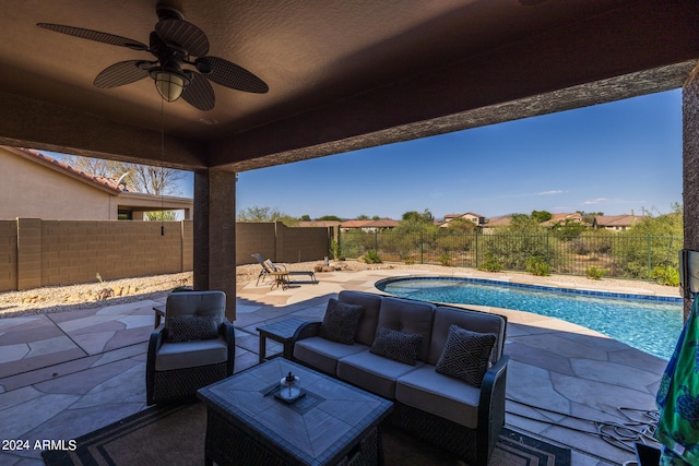 view of patio / terrace featuring a fenced in pool and ceiling fan