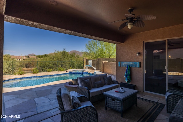 view of patio featuring an outdoor hangout area, a swimming pool with hot tub, ceiling fan, and a mountain view