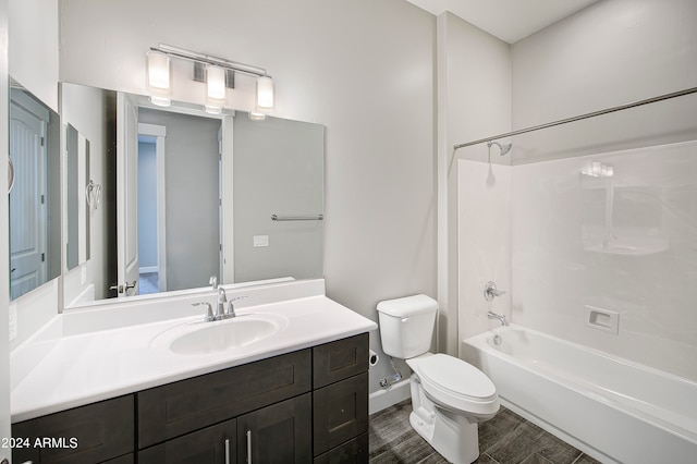 full bathroom featuring hardwood / wood-style flooring, toilet, tub / shower combination, and vanity