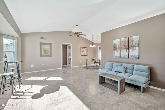 living room with lofted ceiling, a notable chandelier, and plenty of natural light