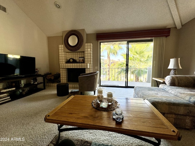 carpeted living room featuring lofted ceiling, a textured ceiling, and a fireplace