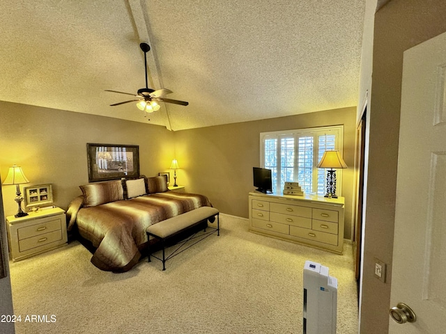 carpeted bedroom featuring a closet, a textured ceiling, ceiling fan, and vaulted ceiling