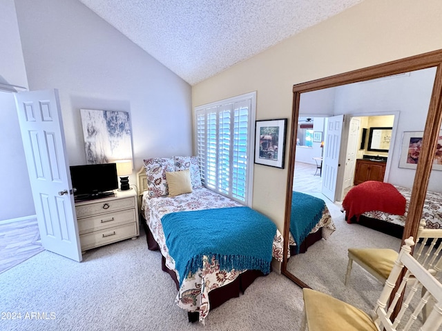 carpeted bedroom with lofted ceiling and a textured ceiling