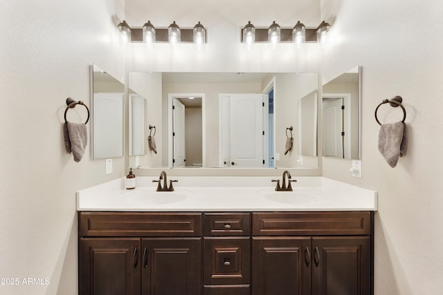 full bath featuring double vanity and a sink