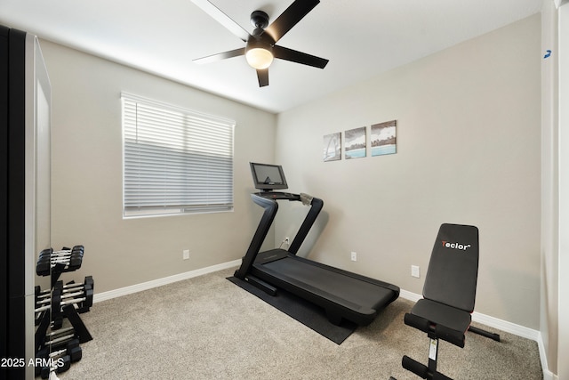workout room with a ceiling fan, baseboards, and carpet floors