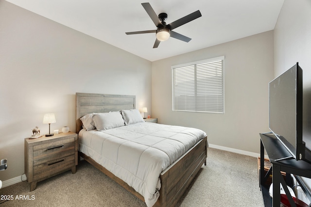 bedroom with light carpet, a ceiling fan, and baseboards