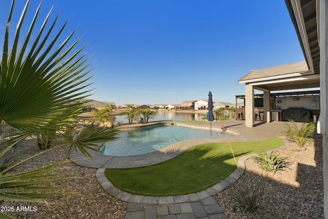 pool featuring outdoor dry bar and a patio area