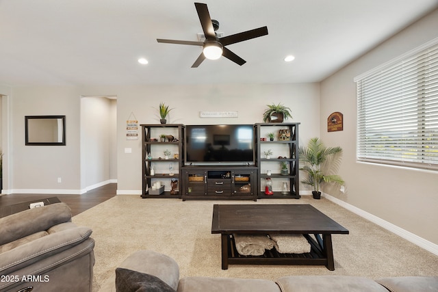 living room with recessed lighting, carpet flooring, a ceiling fan, and baseboards