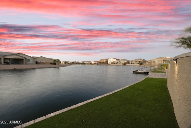 property view of water featuring a residential view and a dock