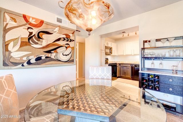 dining area featuring light tile patterned flooring