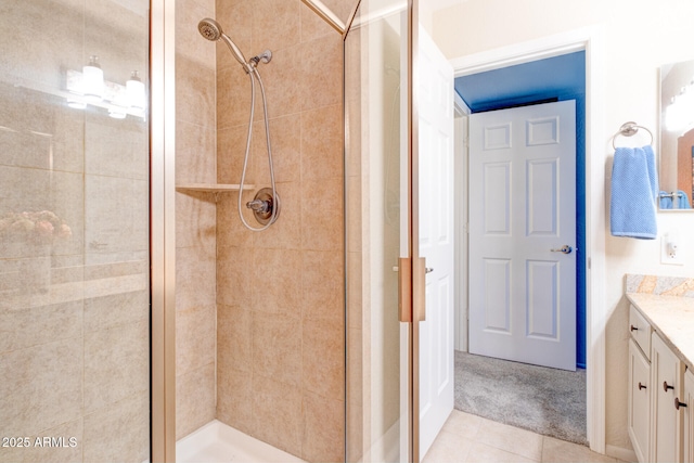 bathroom featuring an enclosed shower, tile patterned floors, and vanity