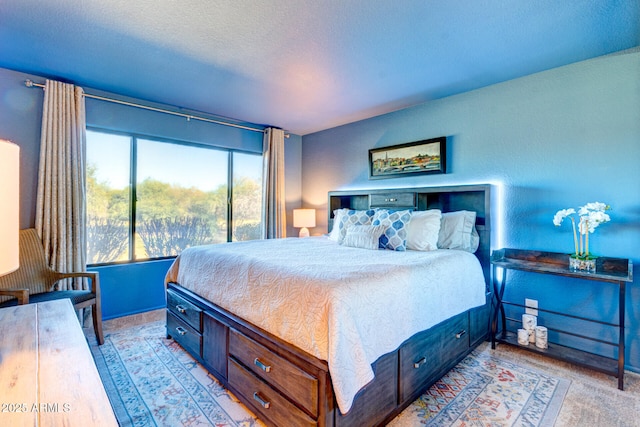 carpeted bedroom with a textured ceiling