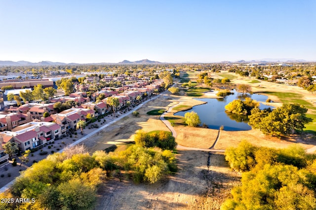 drone / aerial view with a water and mountain view