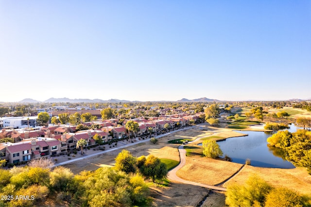 drone / aerial view featuring a water and mountain view