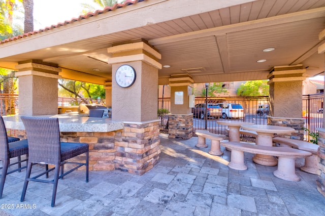 view of patio with exterior kitchen and exterior bar