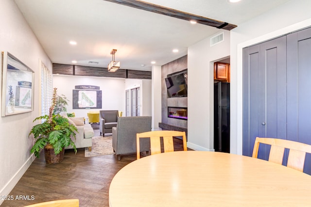 dining area with dark hardwood / wood-style floors