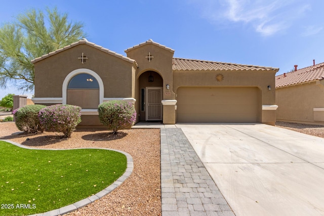 871 E Melanie St, San Tan Valley, AZ 85140 - mediterranean / spanish home featuring a garage, stucco siding, concrete driveway, and a tiled roof