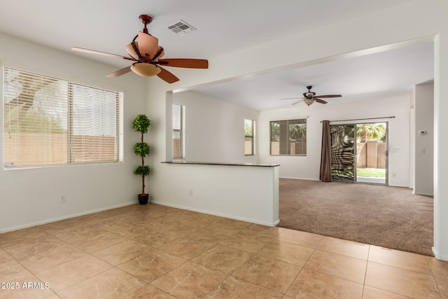 871 E Melanie St, San Tan Valley, AZ 85140 - empty room with ceiling fan, baseboards, light tile patterned flooring, and light colored carpet