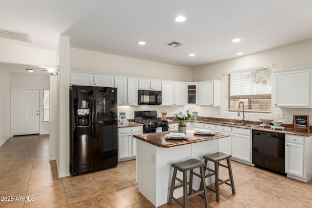 871 E Melanie St, San Tan Valley, AZ 85140 - kitchen featuring black appliances, a sink, white cabinetry, dark countertops, and recessed lighting
