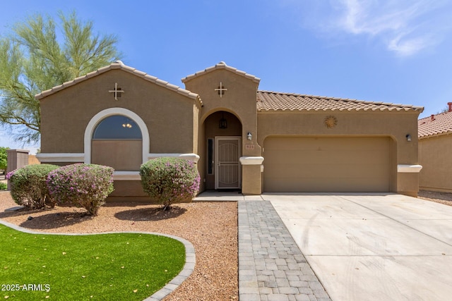 871 E Melanie St, San Tan Valley, AZ 85140 - mediterranean / spanish-style home featuring stucco siding, a garage, driveway, and a tiled roof