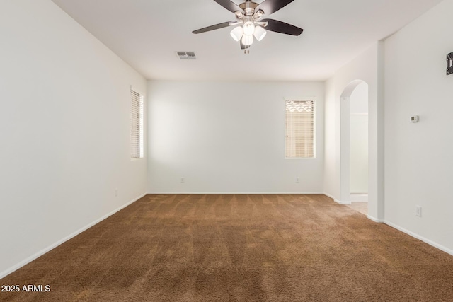 871 E Melanie St, San Tan Valley, AZ 85140 - unfurnished room with arched walkways, carpet, and healthy amount of natural light