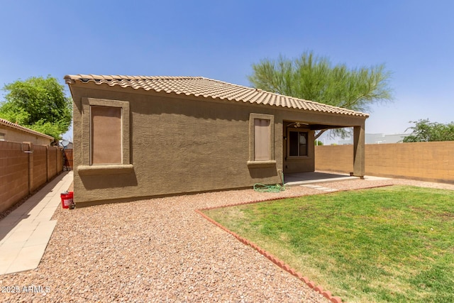 871 E Melanie St, San Tan Valley, AZ 85140 - rear view of house featuring stucco siding, a patio, and a tile roof