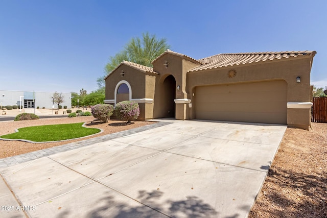 871 E Melanie St, San Tan Valley, AZ 85140 - mediterranean / spanish-style house featuring stucco siding, a garage, concrete driveway, and a tiled roof