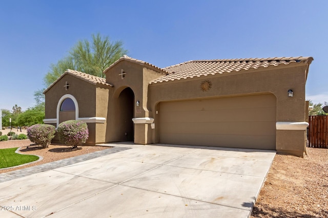 871 E Melanie St, San Tan Valley, AZ 85140 - mediterranean / spanish-style home with stucco siding, a garage, driveway, and a tiled roof