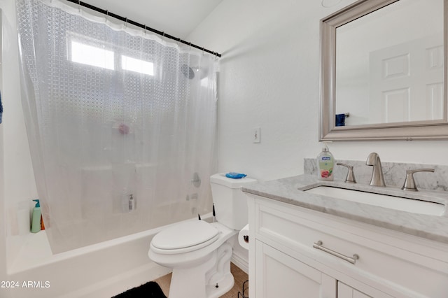 full bathroom with vanity, shower / tub combo, and toilet