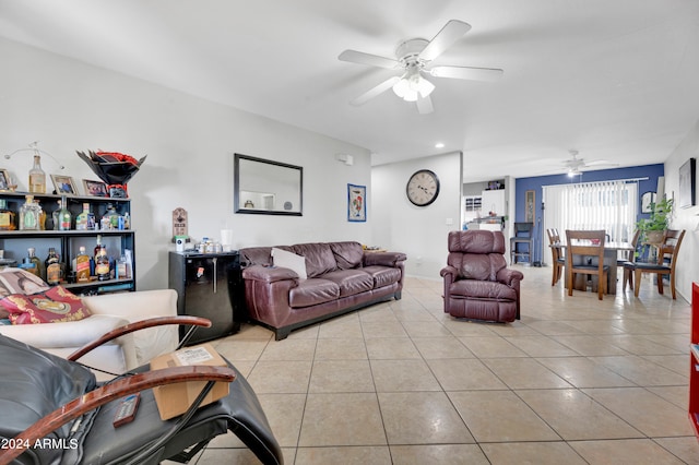 living room with ceiling fan and light tile patterned floors