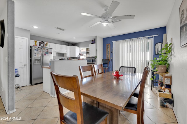 tiled dining room with ceiling fan