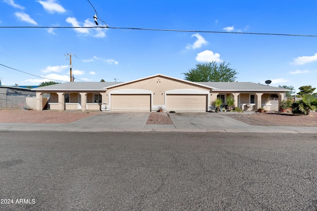 single story home featuring a garage