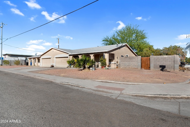 ranch-style home featuring a garage