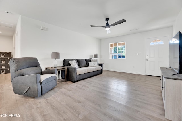 living room with ceiling fan and light hardwood / wood-style floors