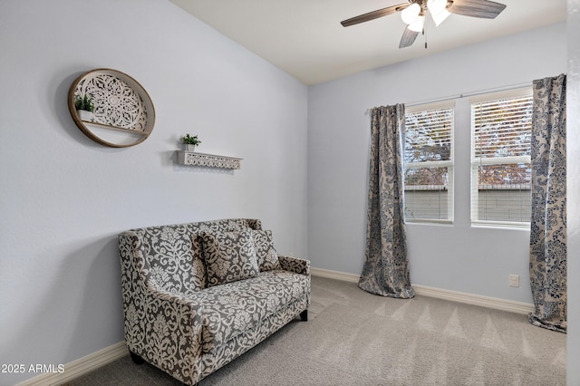 sitting room featuring ceiling fan and carpet flooring