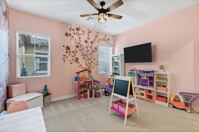 rec room featuring ceiling fan and carpet