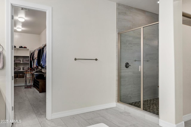 bathroom with a shower with shower door