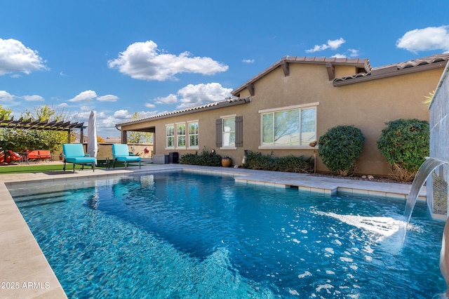 view of pool with pool water feature, a patio area, and a pergola