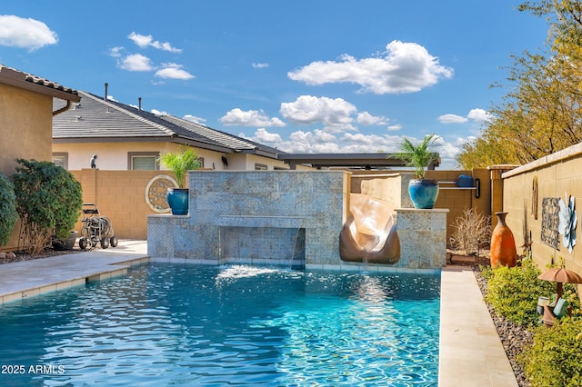 view of swimming pool featuring pool water feature