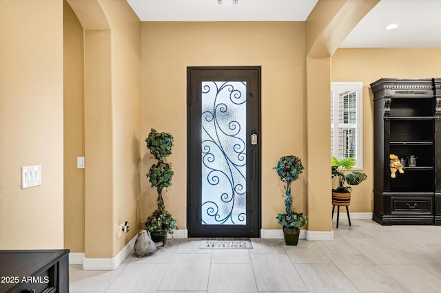 entryway featuring light tile patterned floors