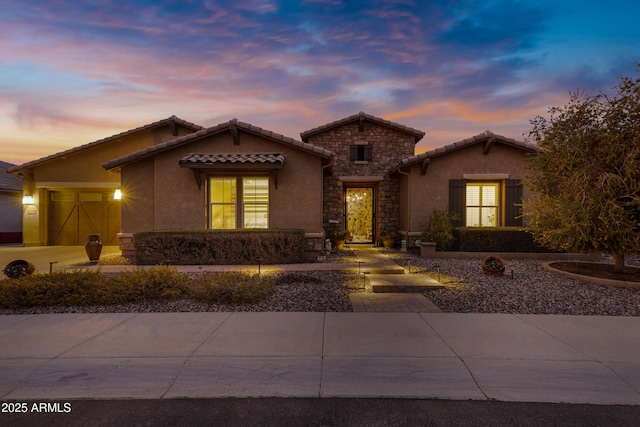 view of front of property featuring a garage