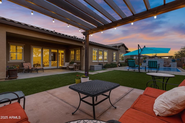 patio terrace at dusk featuring an outdoor hangout area, a pergola, and a lawn