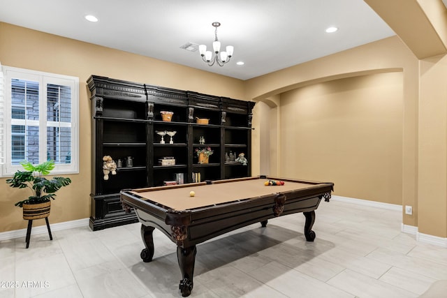 playroom with a notable chandelier and billiards