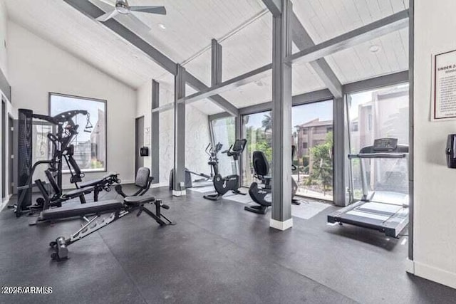 exercise room featuring high vaulted ceiling, ceiling fan, and baseboards