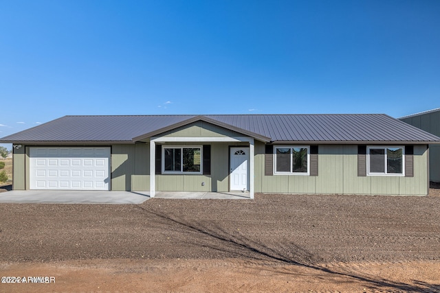 ranch-style house featuring a garage