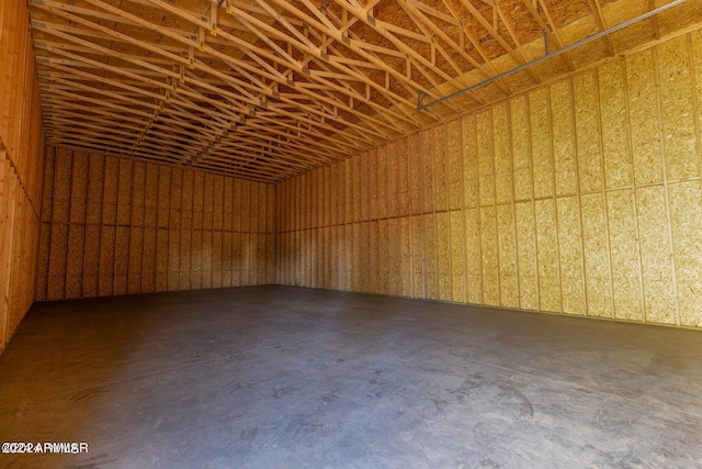 unfurnished room featuring concrete flooring