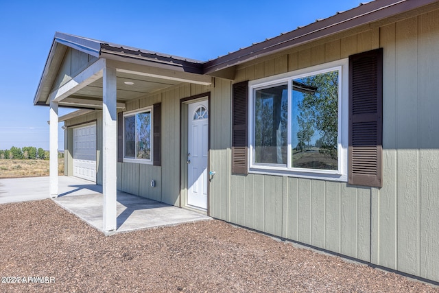 entrance to property featuring a garage