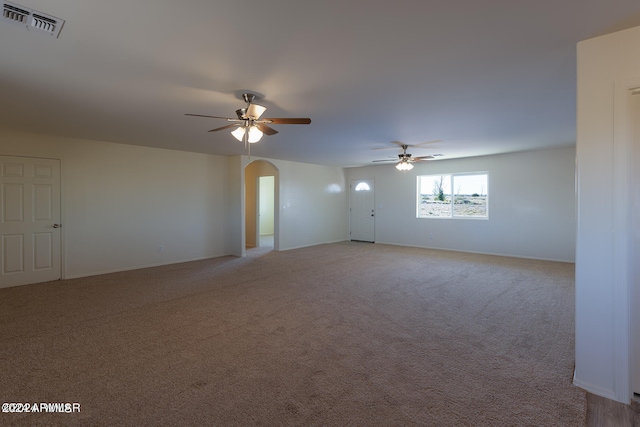 carpeted empty room featuring ceiling fan